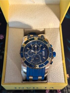 Gold with Blue casing Watch Invicta.